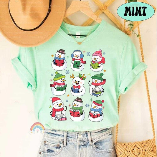 Adorable snowmen gathered with books, bringing winter reading vibes to life in this cozy design.