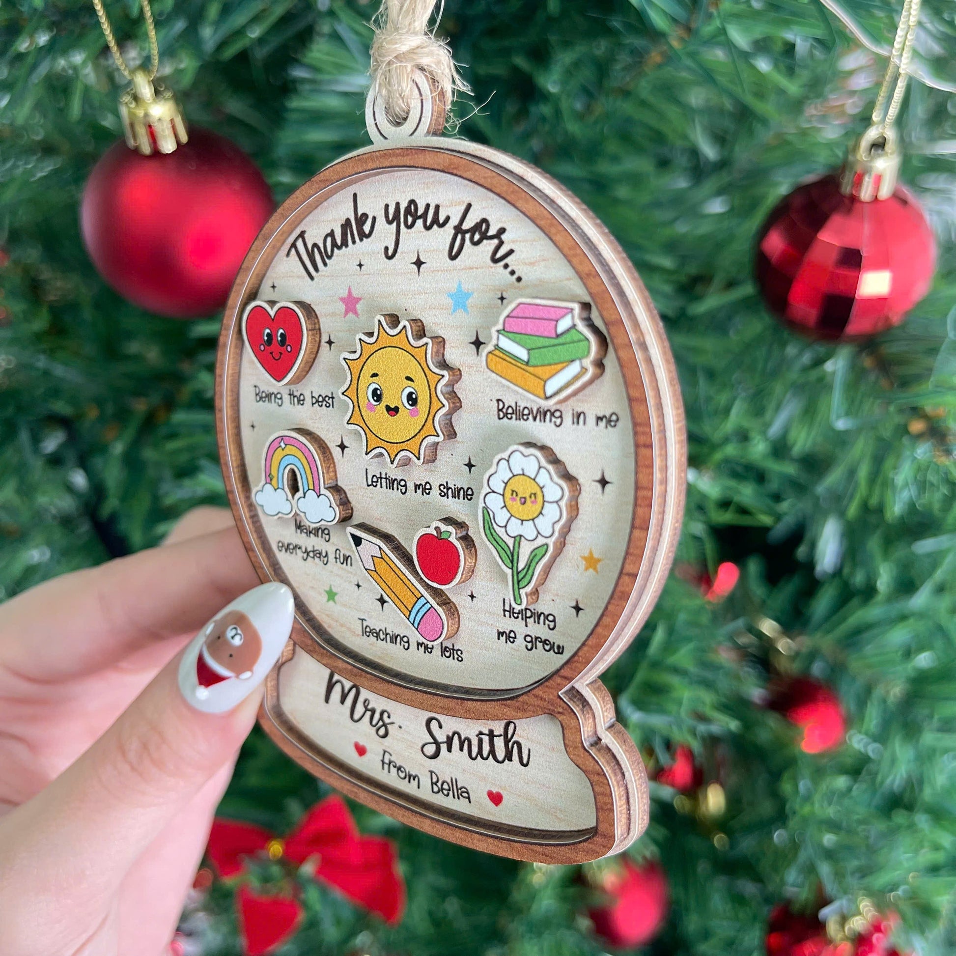 Festive and playful design with bright illustrations like a sun, rainbow, and heart, paired with a thank-you note for Mrs. Smith. Personalized from Bella, this ornament is a perfect holiday gift for teachers.