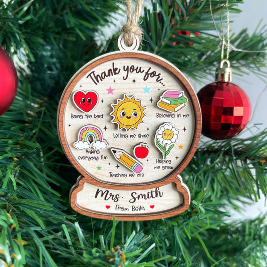 Charming ornament featuring colorful icons and a heartfelt thank-you message for Mrs. Smith, personalized from Bella. Each icon represents special traits like Believing in me and Helping me grow, making it a thoughtful teacher gift.