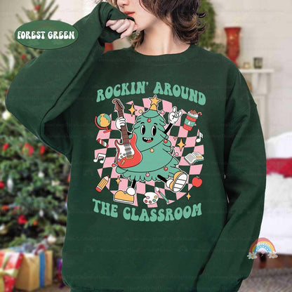 A fun-loving tree with a guitar and holiday icons makes this shirt a festive favorite for classroom celebrations.