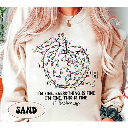 Playful holiday design featuring a tangled mess of lights, capturing the chaotic charm of #TeacherLife.