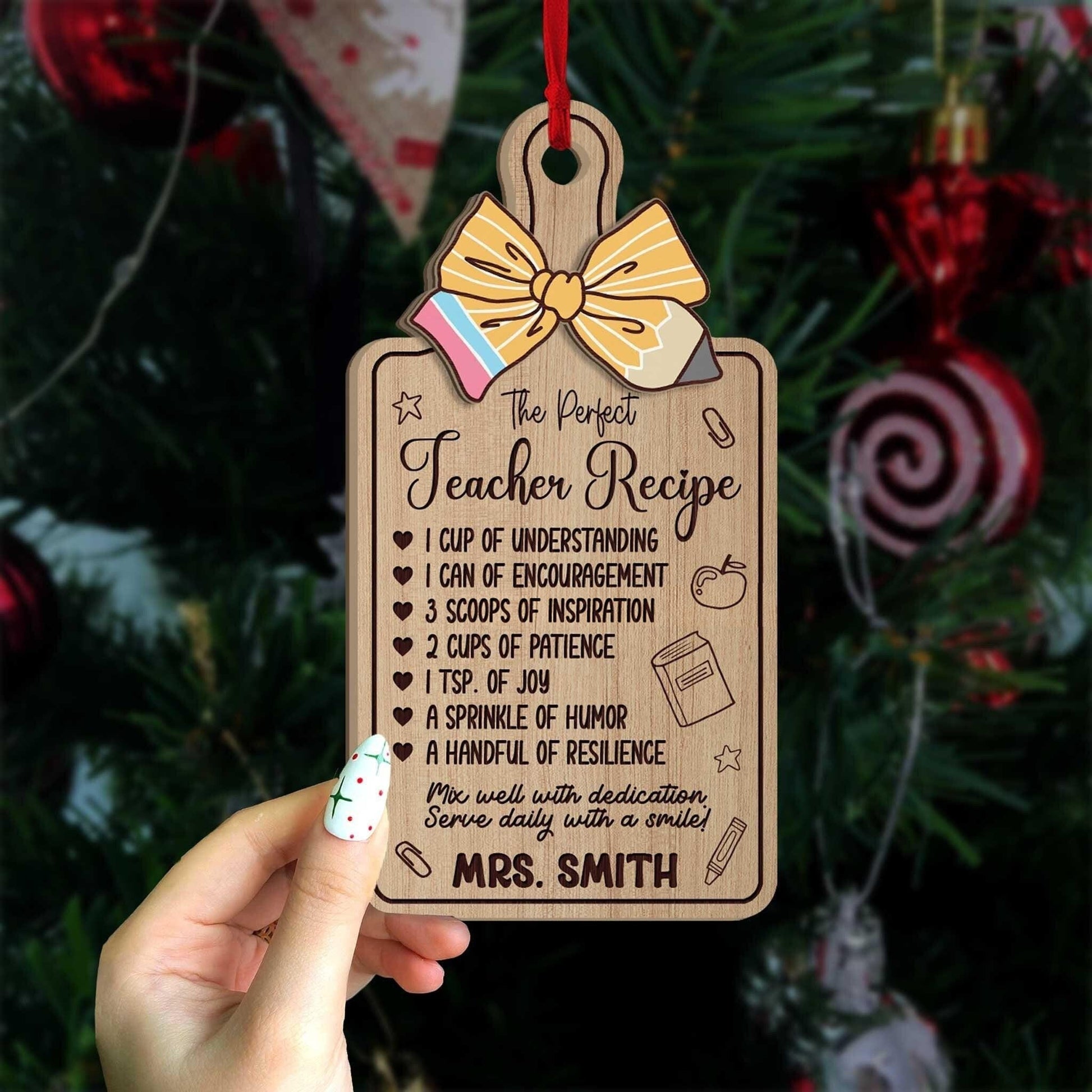 Festive ornament shaped like a recipe card, detailing the perfect teacher recipe with elements like inspiration and resilience. Mrs. Smith’s name is personalized for a unique holiday keepsake.