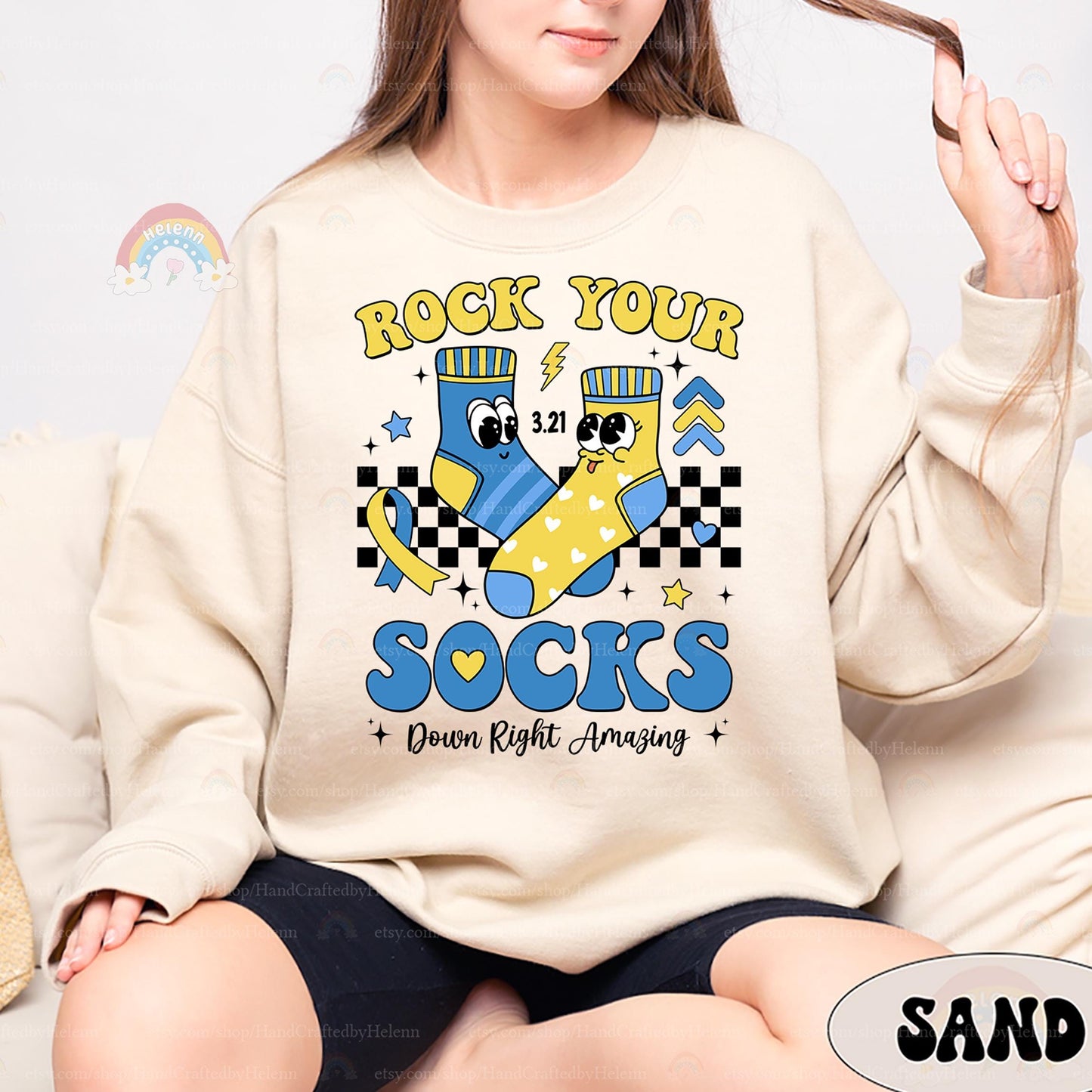 A bright and energetic design featuring animated blue and yellow socks, fun checkered accents, and a ribbon detail. With a message of empowerment, this T-shirt is perfect for wearing on 3.21 or any day you want to celebrate inclusion.