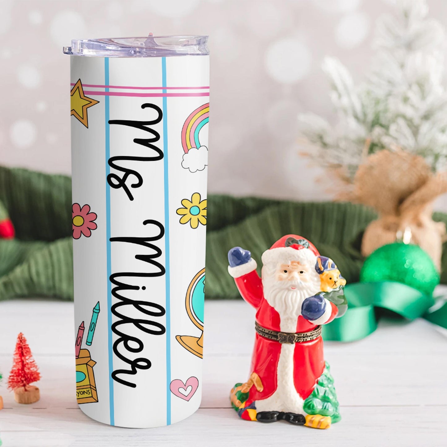 Brighten your teacher&#39;s day with this custom tumbler featuring a notebook paper design, rainbows, stars, and fun school icons. Personalized with their name like “Ms. Miller,” this tumbler keeps drinks hot or cold all day long. Perfect for Teacher Appreciation Week, birthdays, or Christmas gifts!