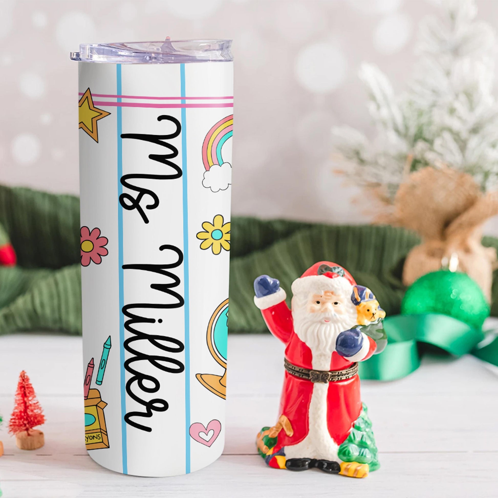 Brighten your teacher&#39;s day with this custom tumbler featuring a notebook paper design, rainbows, stars, and fun school icons. Personalized with their name like “Ms. Miller,” this tumbler keeps drinks hot or cold all day long. Perfect for Teacher Appreciation Week, birthdays, or Christmas gifts!
