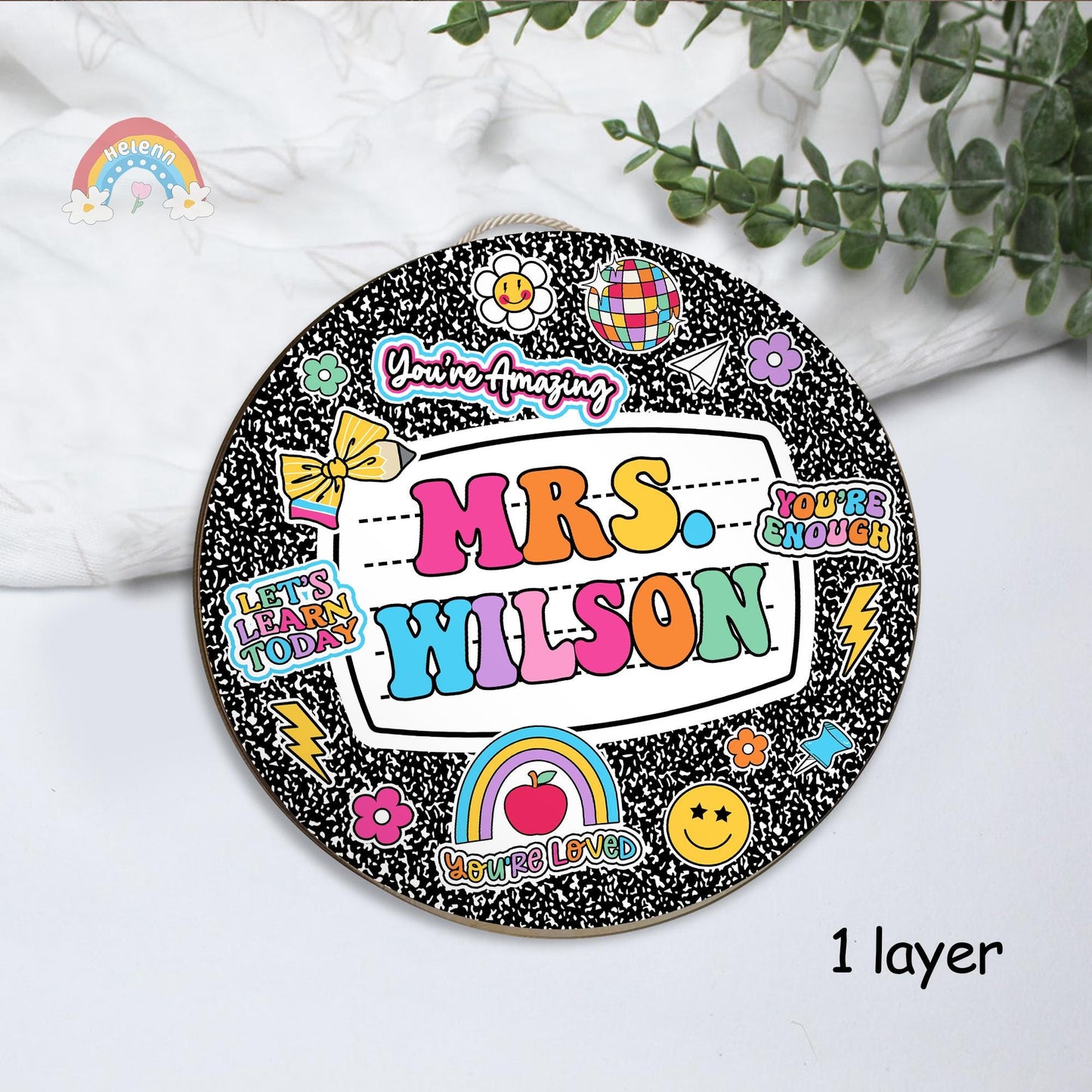 2. 🌈 Bursting with positivity and color, this personalized door hanger makes students smile before they even step inside.