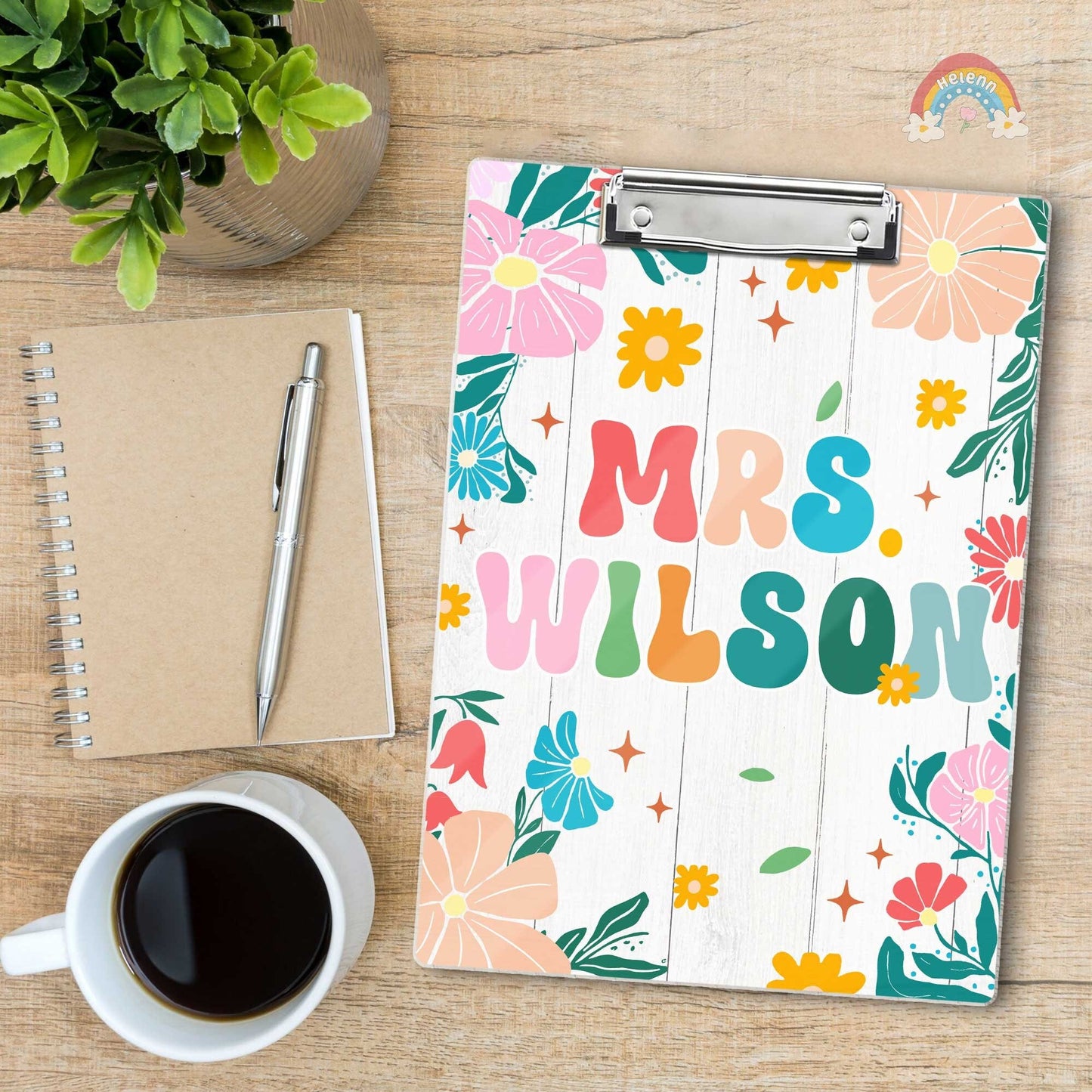 This cheerful clipboard design incorporates a mix of flowers and leaves, creating a lively and inviting look for educational settings.